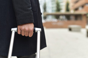 businessman pulling a trolley case.
