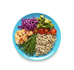 Plate with boiled rice, vegetables and meat on white background