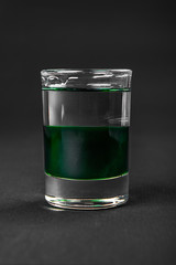 Shot of cocktail isolated black