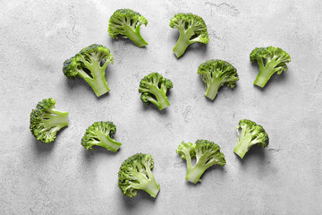 Fresh green broccoli on grey table