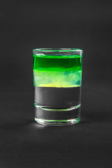 Shot of cocktail isolated black