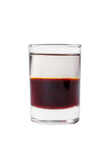 Shot of cocktail isolated white