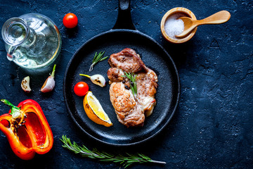 concept cooked steak on dark background top view