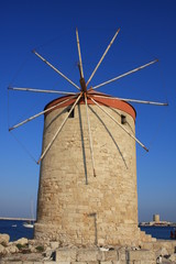 Fototapeta na wymiar The historic Mandraki Windmills in Rhodes Town, Mediterranean Sea, Rhodes Island, Greece