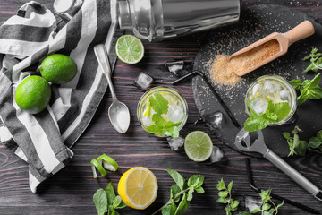 Composition with fresh mojito on wooden table