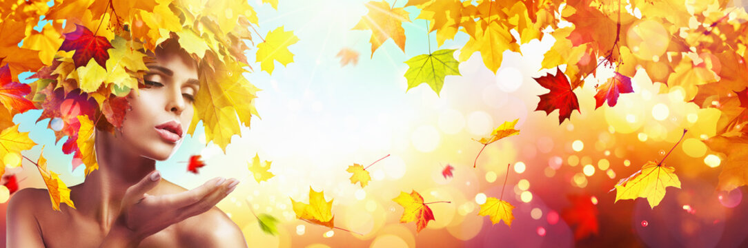 Beautiful Woman In Autumn With Falling Leaves Over Nature Background