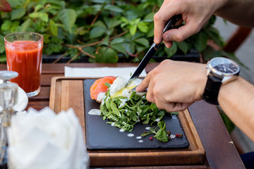 Egg poached with salmon and arugula.