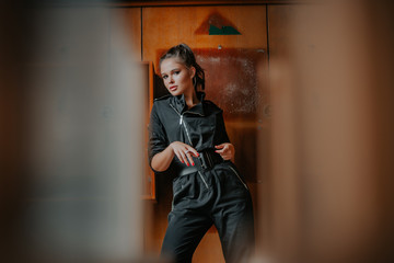 sexy brunette. Stylish clothes. Black jacket. Seductive linen. Bright makeup.