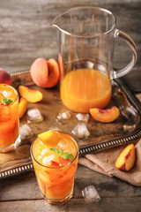 Fresh summer cocktail in glassware on wooden table