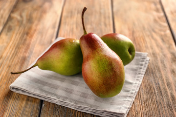 Ripe sweet pears on wooden table