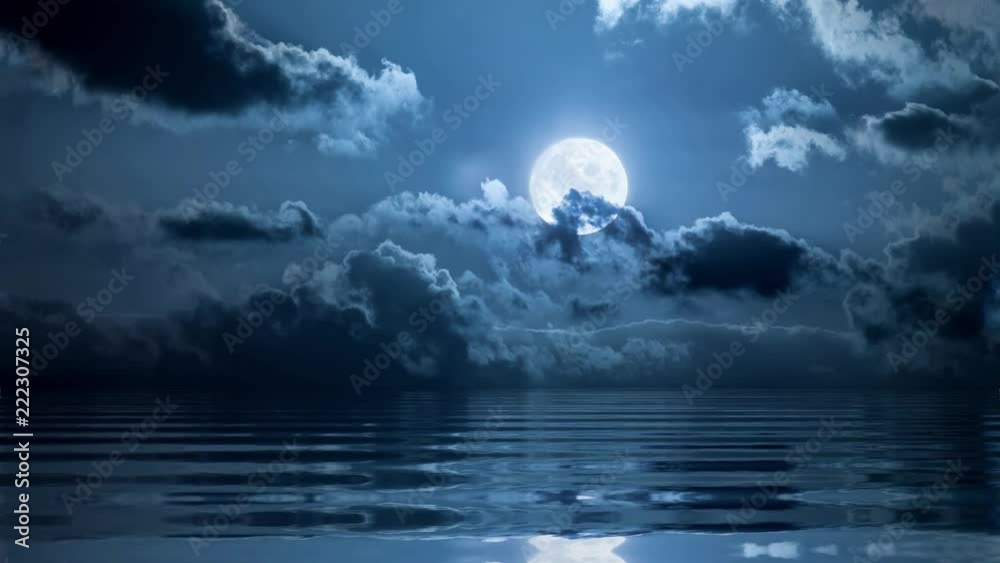 Wall mural full moon in clouds over ocean loopable animation
