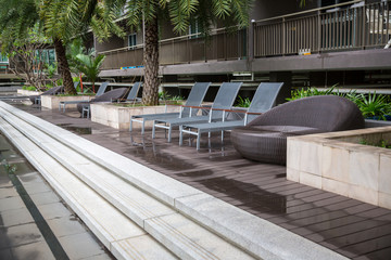 Swimming chair near the swimming pool. bench on pool. image for objects. Exercise in the water. exercise and relax in holidays.