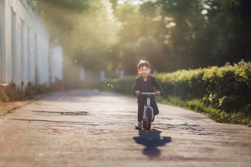 boy riding bicycle in the park