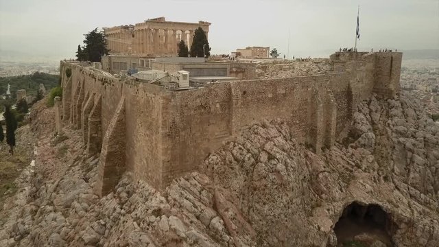 Athens Acropolis Parthenon on cloudy day. City center. Aerial drone view