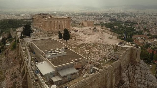 Athens Acropolis Parthenon on cloudy day. City center. Aerial drone view