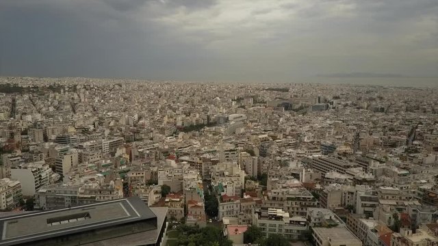 Athens Acropolis Parthenon on cloudy day. City center. Aerial drone view