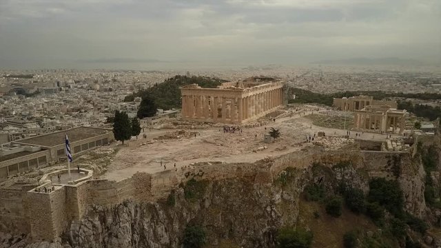 Athens Acropolis Parthenon on cloudy day. City center. Aerial drone view