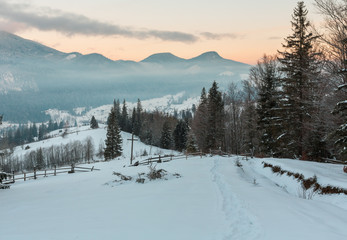 Fototapeta premium Sunrise winter Carpathian mountain village Zelene outskirts, Verkhovyna, Ukraine