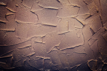 Repair, the design of the premises artistic multi-colored putty on the wall. Brown and vintage...