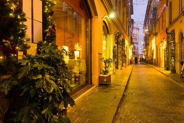 Fototapeta na wymiar New Year's illumination streets of Parma city at dusk
