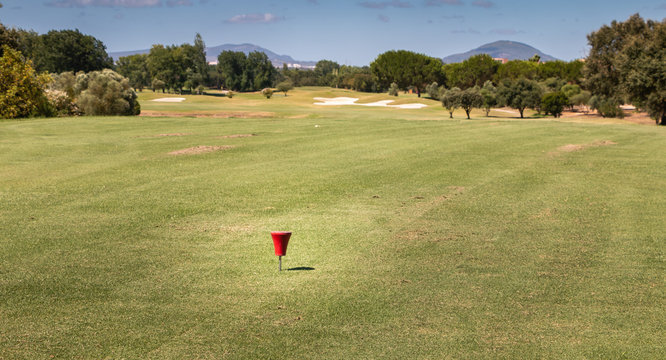 red marker starting on a golf course