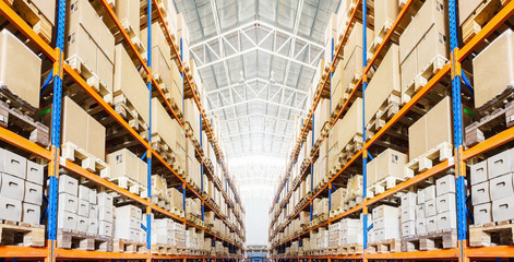 Rows of shelves with boxes in modern warehouse - obrazy, fototapety, plakaty