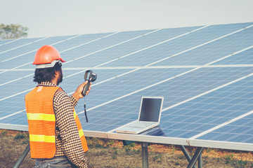 engineer working on checking equipment in solar power plant