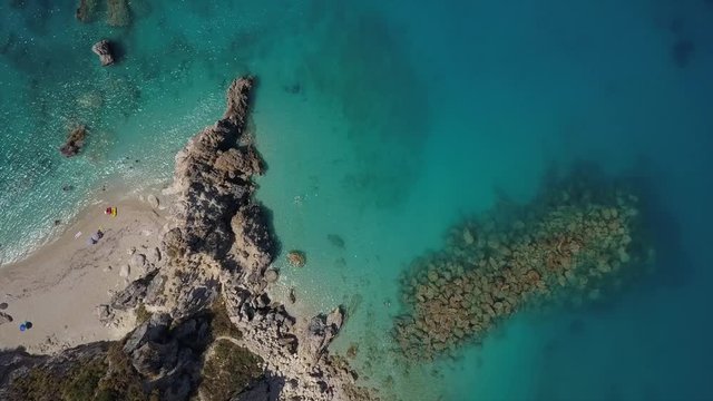 Beautiful colored beach top down drone aerial view.Crystal clear turquoise, blue