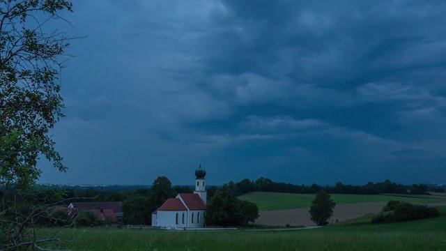 Timelapse of storm, little church, bavaria, germany