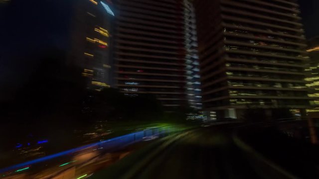 Time lapse of the Docklands in London in motion from a fast moving train at night, POV hyperlapse