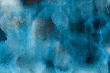 Blue winter watercolor ombre leaks and splashes texture on white watercolor paper background. Painted ice, frost and water.