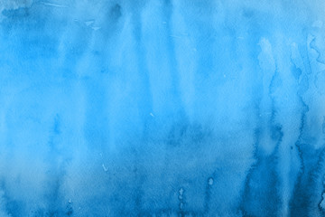 Blue winter watercolor ombre leaks and splashes texture on white watercolor paper background. Painted ice, frost and water.