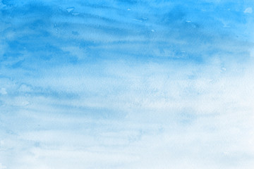 Blue winter watercolor ombre leaks and splashes texture on white watercolor paper background. Painted ice, frost and water. © artistmef