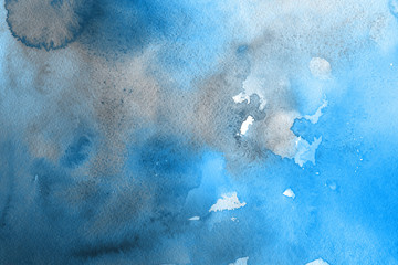 Blue winter watercolor ombre leaks and splashes texture on white watercolor paper background. Painted ice, frost and water.