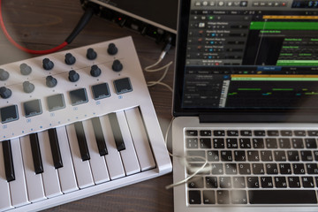 Musician recording place with computer.
