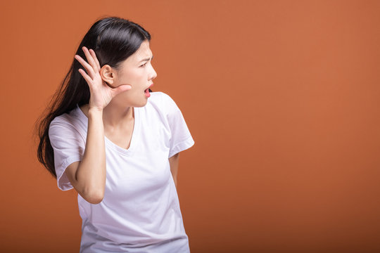 Woman trying to hear pose.