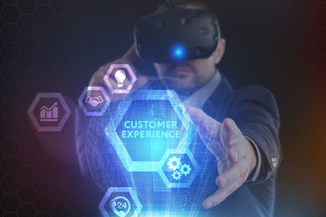 The concept of business, technology, the Internet and the network. A young entrepreneur working on a virtual screen of the future and sees the inscription: Customer experience