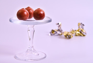 Three bonbons over crystal base