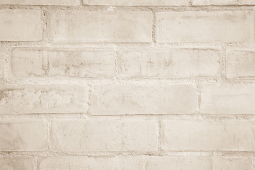 Cream and white brick wall texture background. Brickwork or stonework flooring interior rock old pattern clean concrete grid uneven bricks design stack.