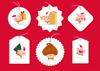 Vector collection of christmas gift tags and badges different shapes isolated on red background. Emblems for xmas holiday presents packaging. New year pig elf character in santa hat cary gift, tree.