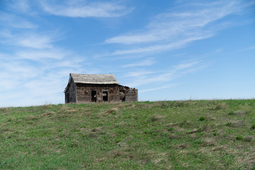 Abandoned old farmhouse in a field 
