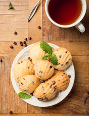 Flat lay with homemade cookies Madeleine with chocolate chips. Holidays and party food concept with copy space. Top view.
