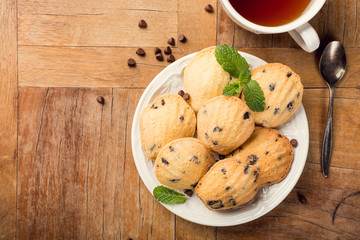 Flat lay with homemade cookies Madeleine with chocolate chips. Holidays and party food concept with copy space. Top view.