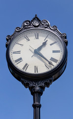Fototapeta na wymiar old clock with blue sky background