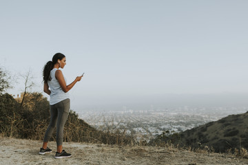 Cheerful woman using a mobile phone