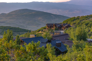 Layers of hills with homes in foreground