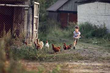 boy running on the path in the village