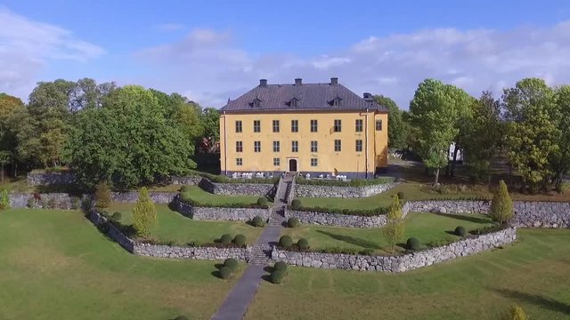 Beautiful castle flyby aerial view. Home, park, alley, fountain and water