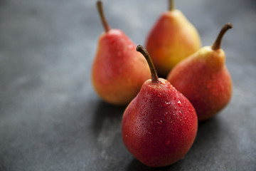 pears, ripe red pears on a dark background, fruit