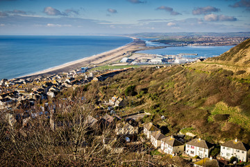 Fototapeta na wymiar Seascape of Chesil beach and Portland harbour looking towards Weymouth, Dorset